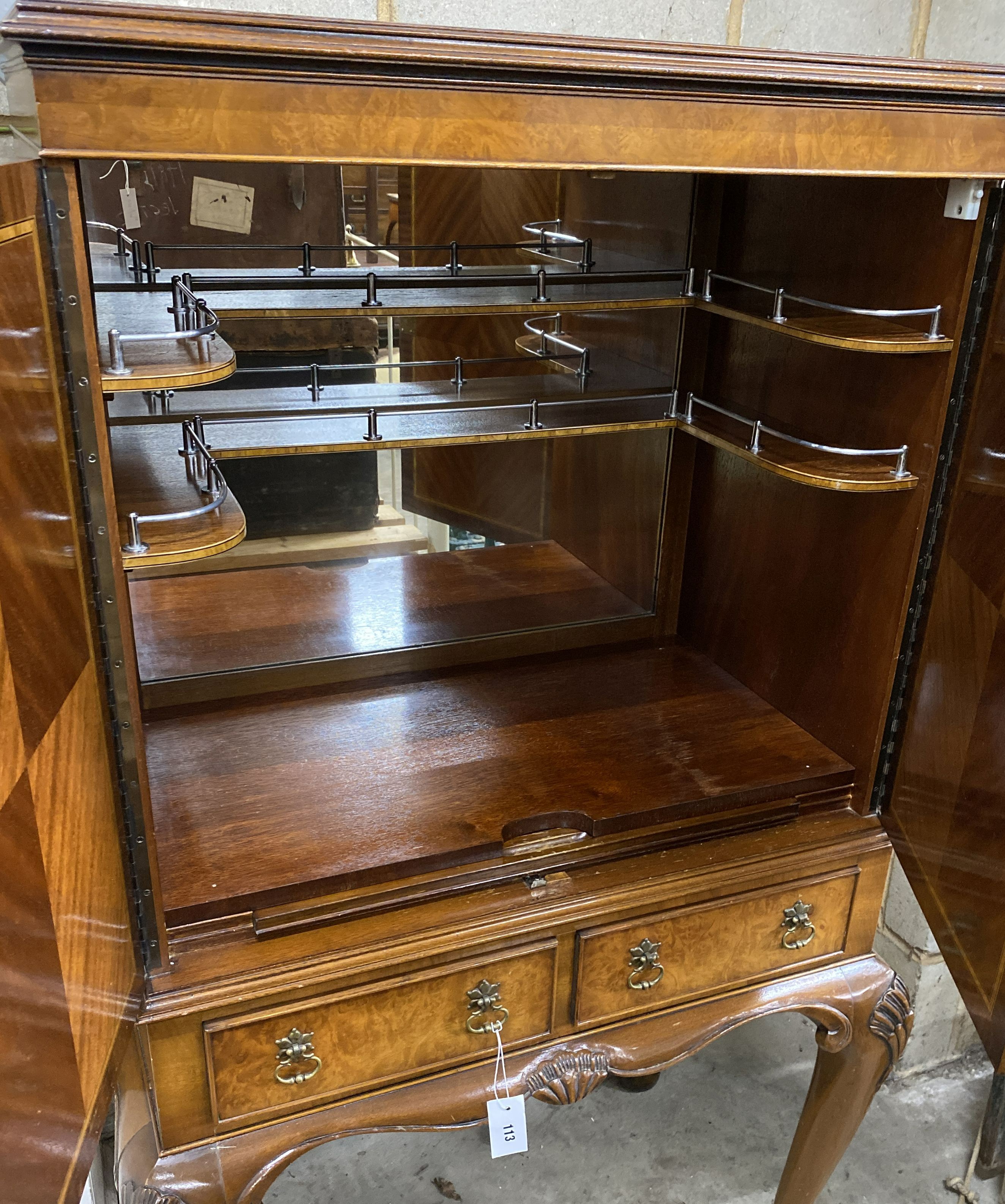 A Queen Anne style walnut cocktail cabinet, width 84cm, depth 52cm, height 147cm